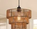 1-Light Farmhouse Rattan Boho Pendant Light with woven rope lampshade hanging over a rustic wooden kitchen island.