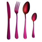 Elegant gold flatware set with fork, knife, and spoon on a white tablecloth