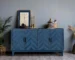 Navy blue solid wood buffet with M-shaped panel doors and traditional design in a dining room