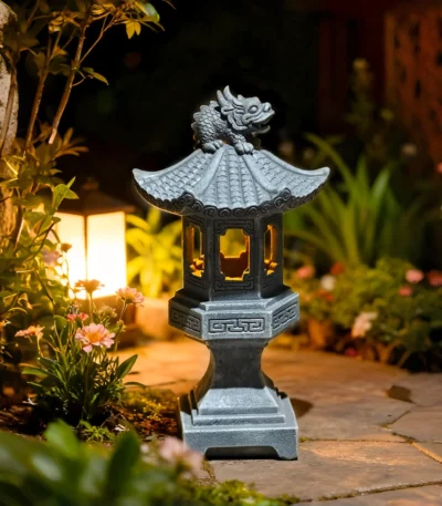 Solar pagoda lantern glowing in a garden at dusk, surrounded by flowers