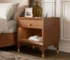 Modern nightstand with USB port and gold capped legs in walnut finish