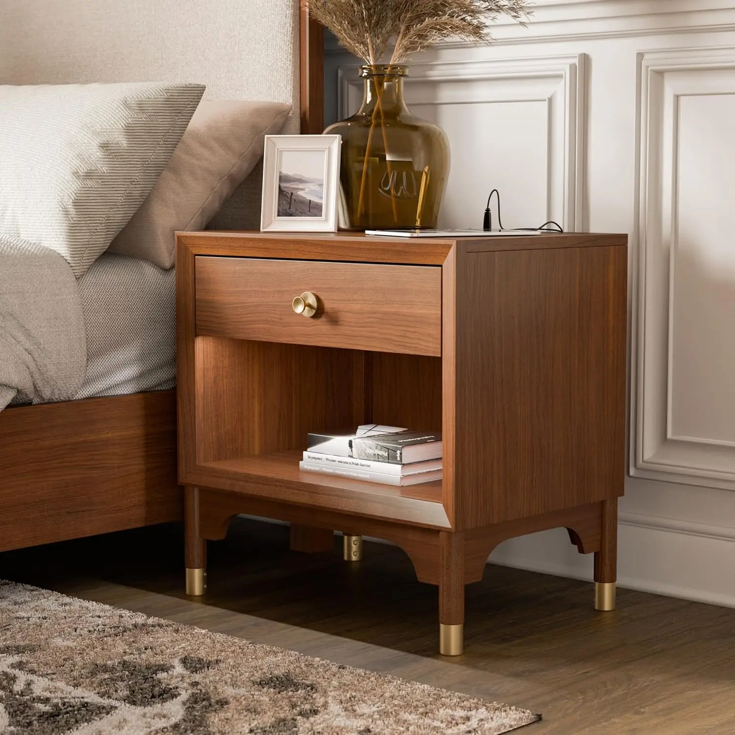 Modern nightstand with USB port and gold capped legs in walnut finish