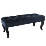 Mid-century velvet ottoman with wood legs in black - Goldoma