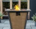 Outdoor gas fire pit column with dancing flames on a patio