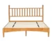 Rustic oak queen bed frame with headboard in a cozy bedroom setting