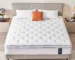 Goldoma 12 Inch Medium Firm Hybrid Mattress in a Box with pocket springs and cooling gel foam on a bed frame