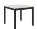 Modern rectangular solid wood dining table with white marble accents in a bright dining room
