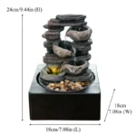 Top-down view of the Goldoma 3-tier fountain showing the water reservoir and the concentric stone tiers, subtle water