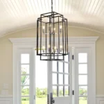 Side view of the industrial metal pendant chandelier showing its layered geometric rings and dark finish