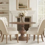Modern 46 round walnut pedestal dining table by Goldoma, perfect for small dining rooms