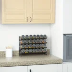 Wall mounted spice rack with 4 layers holding spice jars and oil bottles in a modern kitchen
