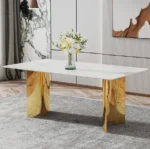 Modern square stone dining table with white marble glass top and gold metal legs in a contemporary dining room