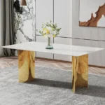 Modern square stone dining table with white marble glass top and gold metal legs in a contemporary dining room