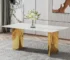 Modern white marble dining table with gold metal legs in a stylish dining room setting