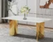 Modern white marble dining table with gold metal legs in a stylish dining room setting
