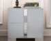 Modern gray nightstand with drawers, mirrored panel, and metal feet in a bedroom setting