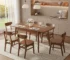Mid-century modern solid wood dining table in walnut with extension leaf