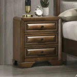 Transitional nightstand with three drawers in brown lacquer finish, placed next to a bed in a bedroom