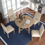 Farmhouse dining table set with extendable round solid wood table and four upholstered chairs in natural wood wash finish