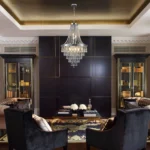 Modern crystal chandelier in chrome finish with clear K9 crystals hanging over a dining table