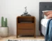 Lionel mid-century modern solid wood nightstand with two drawers in a bedroom setting