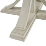 Modern round dining table in antique cream finish with solid wood legs, perfect for a stylish dining room.