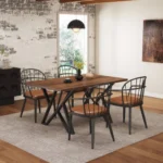 Walnut MDF dining table with black metal legs in an indoor dining room setting