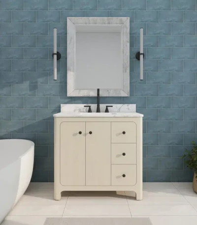 Modern freestanding bathroom vanity with sink, soft close drawers, and a sleek white countertop in a bright bathroom.