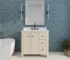 Modern freestanding bathroom vanity with sink, soft close drawers, and a sleek white countertop in a bright bathroom.