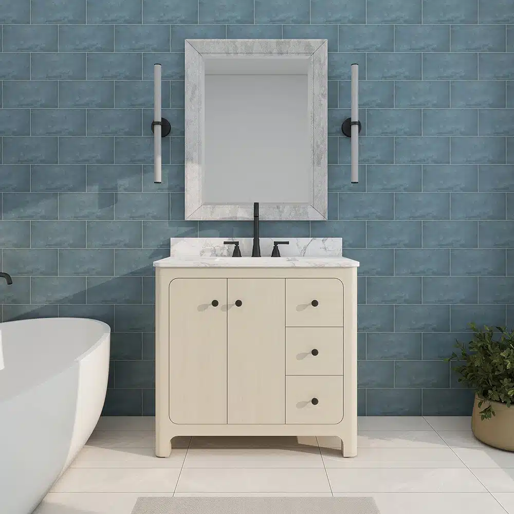Modern freestanding bathroom vanity with sink, soft close drawers, and a sleek white countertop in a bright bathroom.