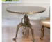 Adjustable height round pedestal dining table with antiqued nickel pedestal base in a modern dining room