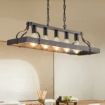 Pendant light hung at adjustable chain height in a modern living room setting.