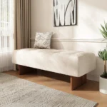 Goldoma modern tufted linen bench with solid wood legs and button tufting in a living room setting