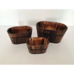 Brown wooden garden planter set with three planters arranged on a patio