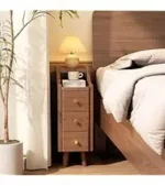Narrow Solid Walnut Wood Nightstand with 3 Drawers – in a cozy room setting