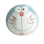 Japanese ceramic dinnerware set with hand-drawn cat design on blue rectangular plate and bowl