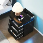 Modern black wooden nightstand with built-in charging station and LED lighting, featuring 3 drawers and sliding top