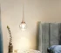 Goldoma 5W Mini LED Jellyfish pendant light with acrylic shade, warm glow over kitchen island
