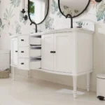 White bathroom vanity with double sinks and chrome faucets, installed against a tiled wall, 60 inch size.