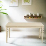 Urban style wired white dining table with turned legs and wood grain finish in a modern home setting