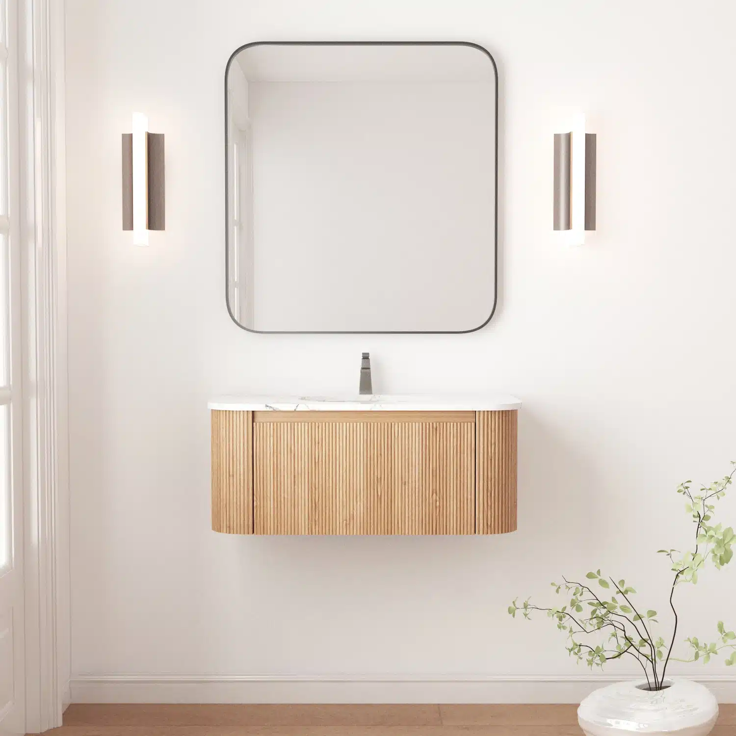 Floating curved bathroom vanity cabinet in white with marble countertop, mounted on wall, front view.
