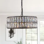 Modern black crystal chandelier hanging over a dining table, 18-inch round adjustable height pendant light with