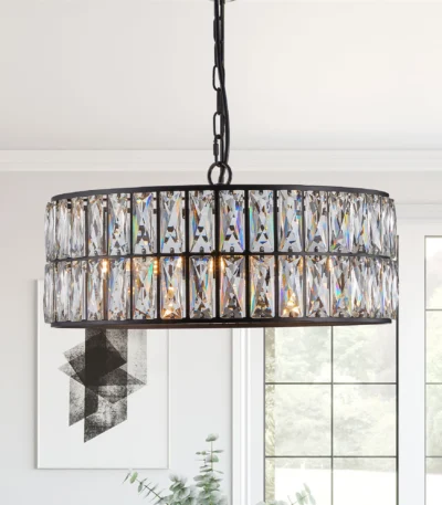 Modern black crystal chandelier hanging over a dining table, 18-inch round adjustable height pendant light with