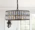 Modern black crystal chandelier hanging over a dining table, 18-inch round adjustable height pendant light with