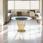 48" Clear and Gold Round Glass Dining Table with Pedestal Base – side view