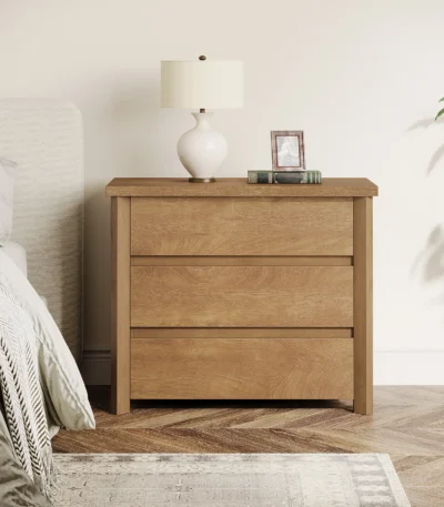 Beige white 3-drawer farmhouse nightstand with ample storage and a large tabletop, perfect for a modern rustic bedroom.