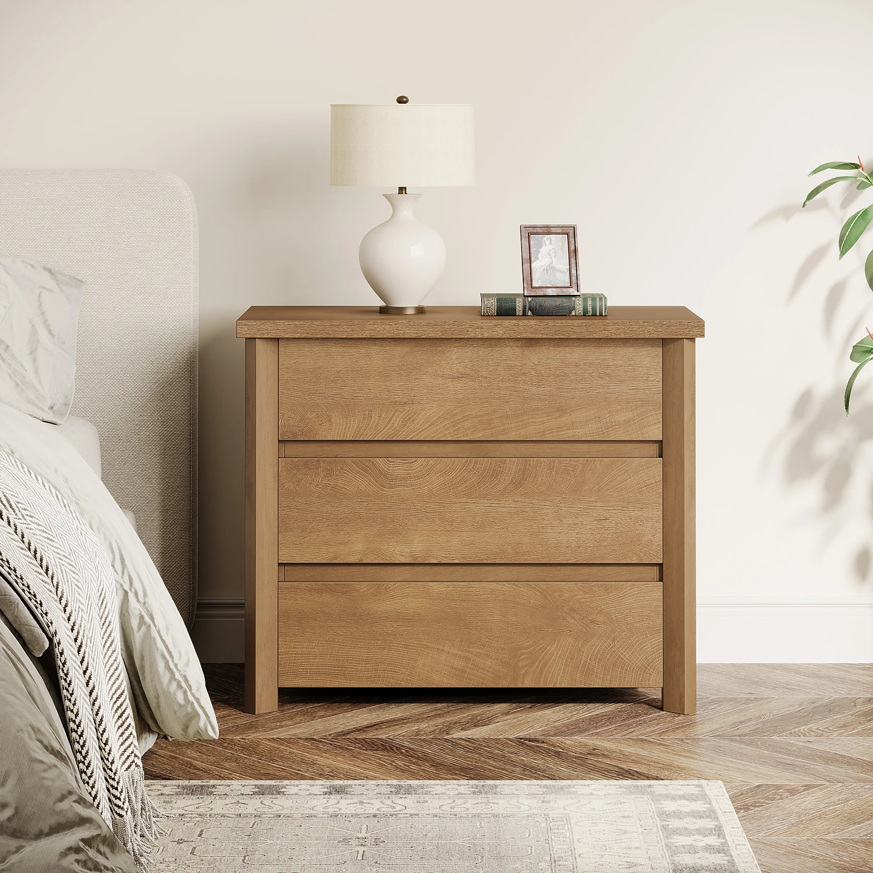H79158eb7ea30486a984783a539ba649dI.webp Beige white 3-drawer farmhouse nightstand with ample storage and a large tabletop, perfect for a modern rustic bedroom.