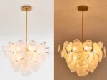 Vintage gold chandelier hanging over a dining table with warm glow