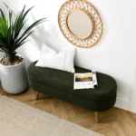 Green oval storage ottoman bench with rubber wood legs and lid open showing interior storage space
