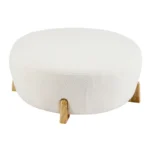 Goldoma white fabric footrest stool with splayed rubber wood legs in a living room near a sofa